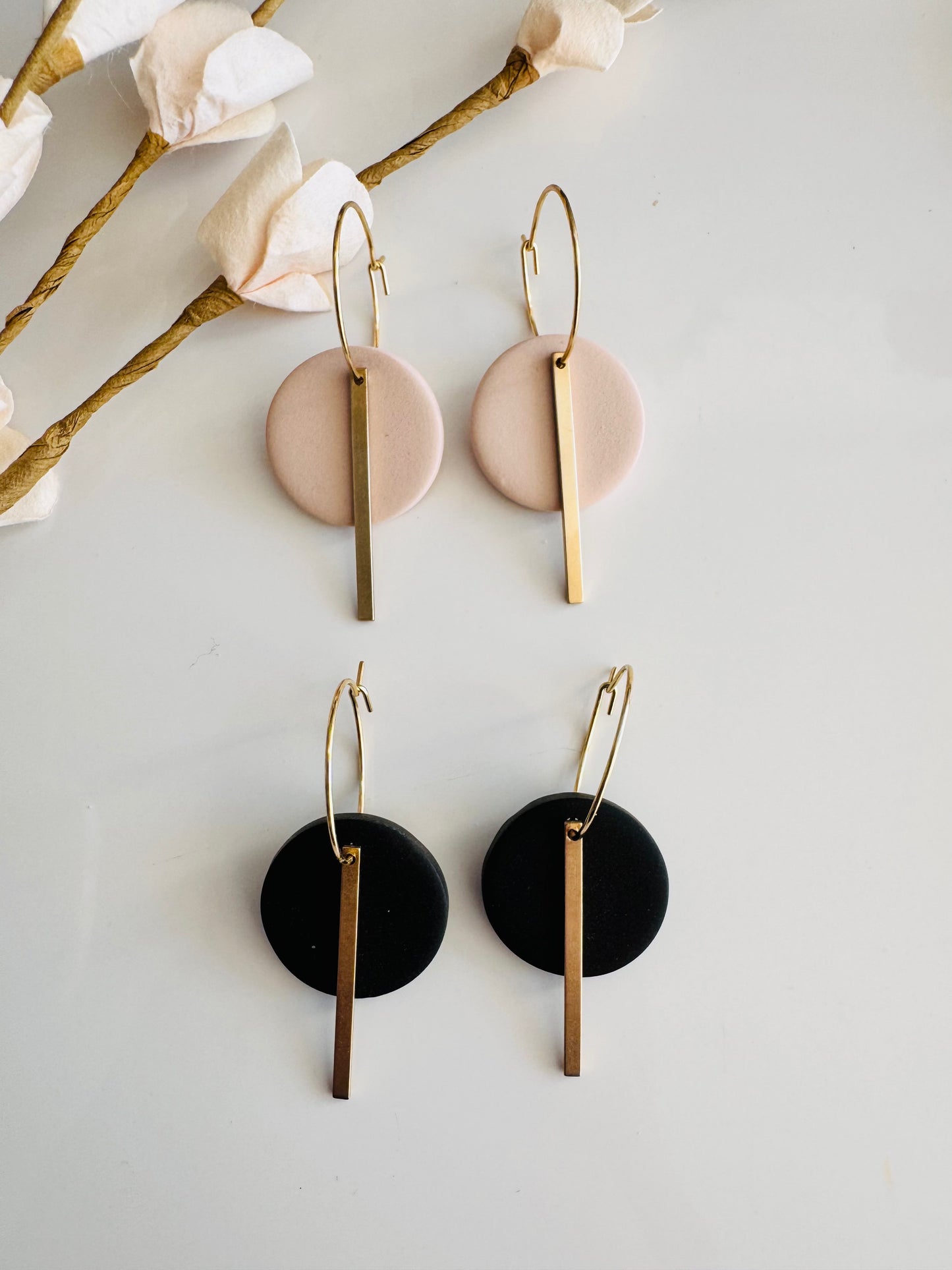 Black round polymer clay earrings, with gold charm and surgical steel hoops