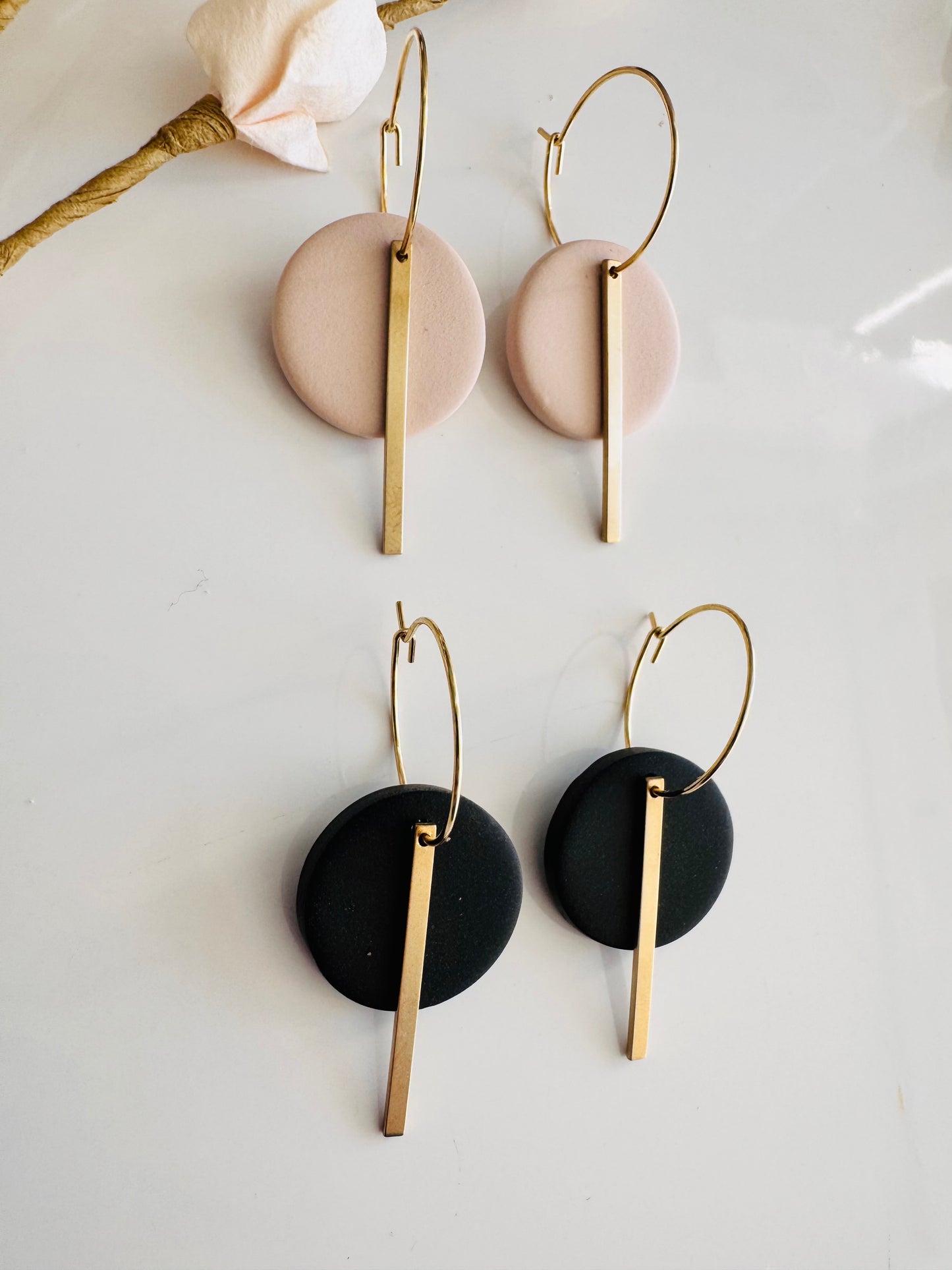 Black round polymer clay earrings, with gold charm and surgical steel hoops